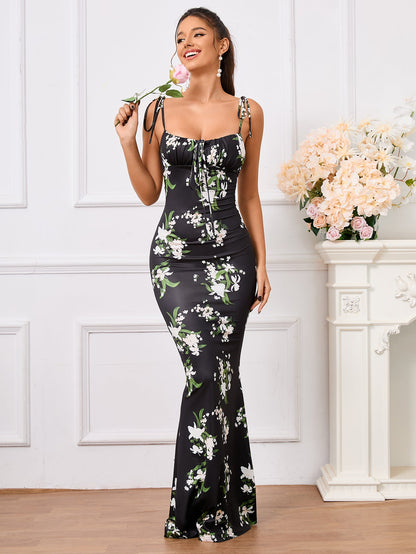 Charmante bloemenprint feestjurk met elegante strik-schouderband en fishtail zoom